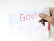 © vinzstudio - business hand holding a piece of goal paper