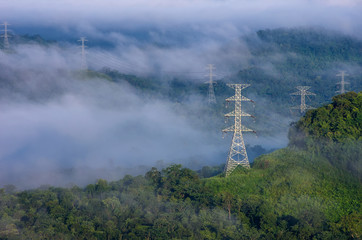 electric transmission towers in fog