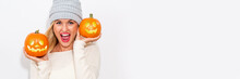 Young Woman Holding Pumpkins On A White Background
