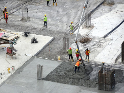 kuala lumpur, malaysia -august 27, 2018: concreting work by construction workers at the construction