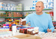 © JackF - Man buying food in supermarket