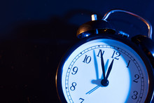 Five Minutes To Midnight On Retro Analog Clock