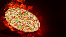 Hot Fresh Traditional Italian Pizza In Flames