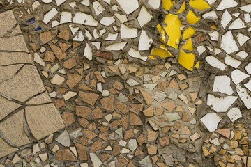 beautiful wall of fragments of tiles, ceramics, glass