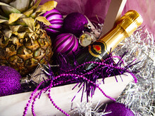 Festive Composition With Pineapple And Champagne In A Decorative Box