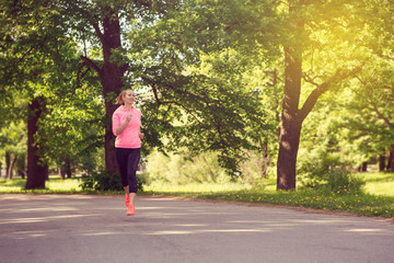 Wall Mural - fitness woman training and jogging in summer park