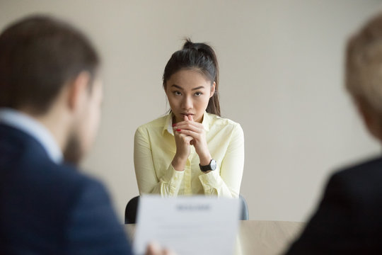 nervous young asian job applicant wait for recruiters question during interview in office, worried i