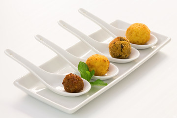 Fried meat balls in a white plate on white background with copy space