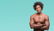 © Krakenimages.com - Afro american shirtless man showing nude body over isolated background happy face smiling with crossed arms looking at the camera. Positive person.