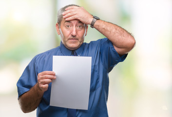 Sticker - Handsome senior man holding blank sheet paper over isolated background stressed with hand on head, shocked with shame and surprise face, angry and frustrated. Fear and upset for mistake.