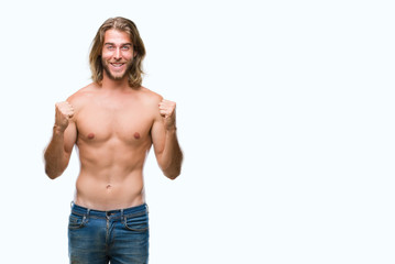 Young handsome shirtless man with long hair showing sexy body over isolated background celebrating surprised and amazed for success with arms raised and open eyes. Winner concept.