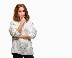 Young beautiful woman over isolated background wearing winter sweater looking confident at the camera with smile with crossed arms and hand raised on chin. Thinking positive.