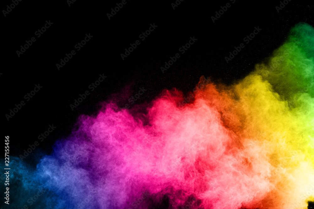 abstract colored dust explosion on a black background.abstract powder ...