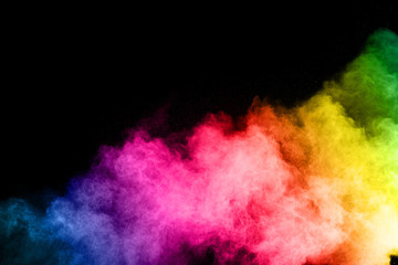 Canvas Print - abstract colored dust explosion on a black background.abstract powder splatted background,freeze mot