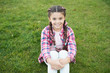 © be free - Sitting in park. Girl enjoying nature and warm weather. Beautiful fresh face. Fashionable look and hairstyle. Waiting for picnic. Sitting on grass