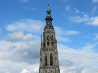 Grote Kerk gothic church tower in Breda Netherlands, blue sky