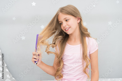 Child Curly Hairstyle Hold Hairbrush Or Comb Apply Oil Before