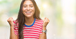 © Krakenimages.com - Young beautiful arab woman over isolated background celebrating surprised and amazed for success with arms raised and open eyes. Winner concept.