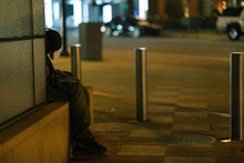 Homeless Man At Night In City