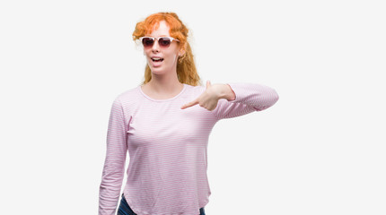 Sticker - Young redhead woman wearing sunglasses with surprise face pointing finger to himself