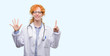 © Krakenimages.com - Young redhead woman wearing doctor uniform showing and pointing up with fingers number six while smiling confident and happy.
