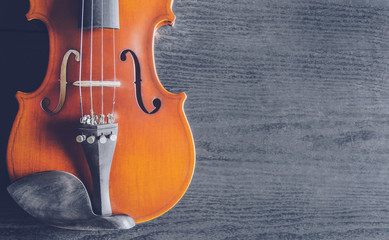 The violin on the dark table, Classic musical instrument used in the orchestra.