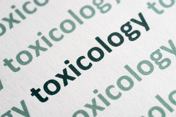 Wall Mural - word toxicology printed on paper macro