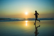 © TheVisualsYouNeed - silhouette of young happy and attractive African American runner woman exercising in running fitness workout at beautiful beach jogging and enjoying sunset