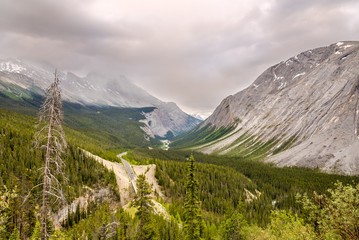Wall Mural - Icefields Parkway road between mountain massifs of Canadian Rocky Mountains.