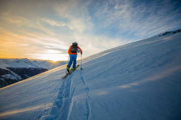 Fototapete - Skitouring with amazing view of swiss famous mountains in beautiful winter powder snow of Alps.