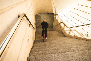 Wall Mural - Guy riding a bmx bike in the streets of the city