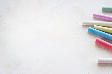 chalks in a variety of colors arranged on a white background