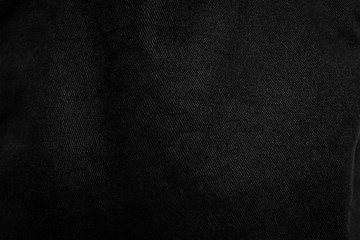 Wall Mural - Crumpled black fabric texture background. Detail of dark textile.