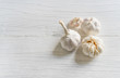 © Lifestyle Graphic - Organic garlic whole and cloves on wooden background.
