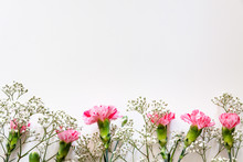 White Copy Space With Pink Carnations And White Field Flowers