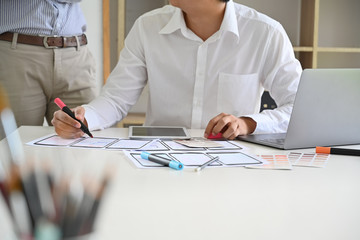 UI Designer drawing website UX layout app development.