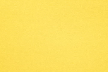 yellow paper texture background. colored cardboard fibers and grain. empty space concept.