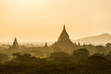 Wall Mural - Old Bagan pagodas and temples at sunrise in Myanmar