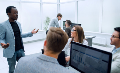 employee shares his ideas with the business team