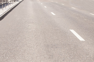 Straight road with white markings.