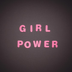 GIRL POWER writing on black paper background