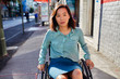 © Brad Ogbonna - Young woman in wheelchair on sidewalk