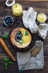 Wall Mural -  Dutch Baby pancake with lemon curd and blueberries