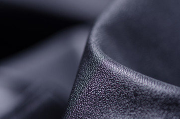 Black leather fabric textile material texture macro blur background