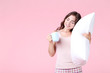 © 5second - Beautiful girl holding cup of tea and white pillow on pink background