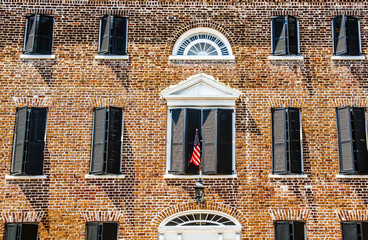 Wall Mural - American Flag on Old Brick Building