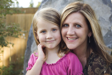 portrait of mother and daughter in park