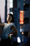 Fototapeta  - Japanese Girl poses on the street in Yokohama, Japan. Yokohama is a port city located in a bit south of Tokyo.