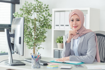 Wall Mural - Arabian office lady sitting in office