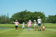 © jamesteohart - Family jumping together hand in hand  enjoy in the park